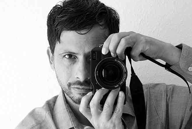 Portrait of Diego Vega with Leica camera